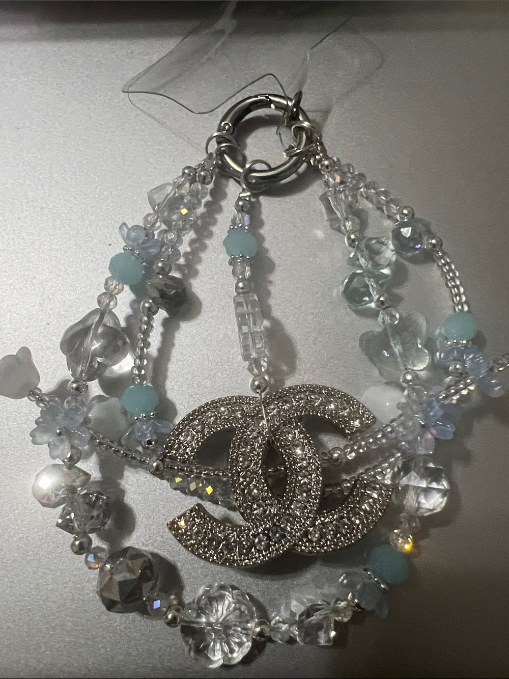 Silver Crystal Multi-Strand Bracelet with Interlocking Logo Accent